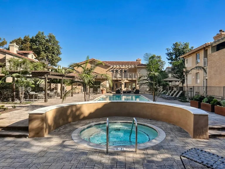 Shared heated pool sparkle from intimate spa edge.