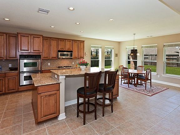 View of the gourmet Kitchen with island seating and breakfast nook