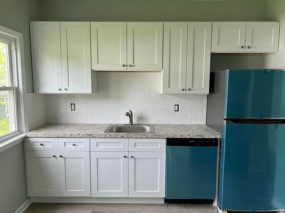 Kitchen updated in 2022 with new no-slam cabinets, counters, and stainless steel appliances