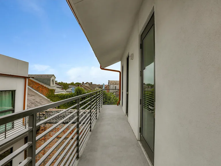 The terrace on the third floor extends the length of the building and offers quaint, rooftop views of the French Quarter.