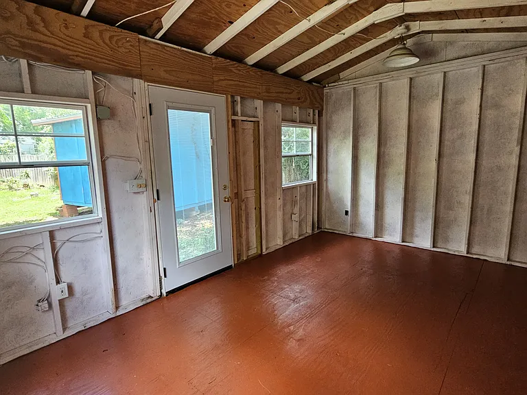 Orange Shed with Electrified outdoor shed suitable for storage, tools, or a small workshop