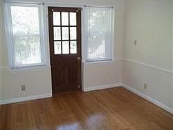 Bedroom withd door leading out to private balcony