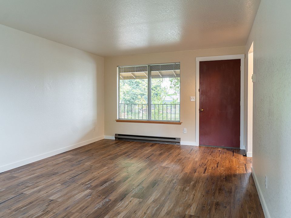 living room with vinyl flooring throughout the unit