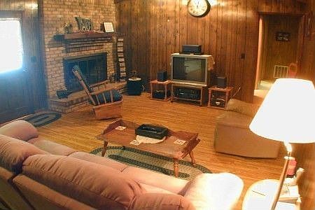 Warm and cozy with a gas fireplace, cathedral ceilings, and ceiling fans!