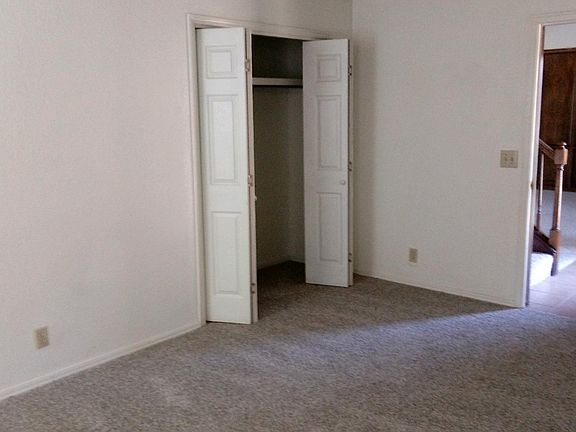 Looking at entry and open doors to closet in master bedroom