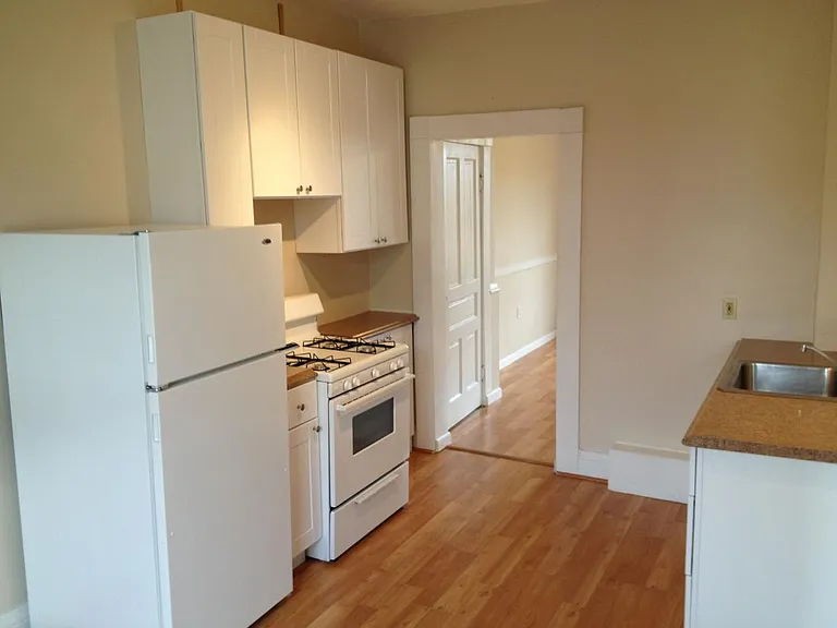 Kitchen w/view into living room