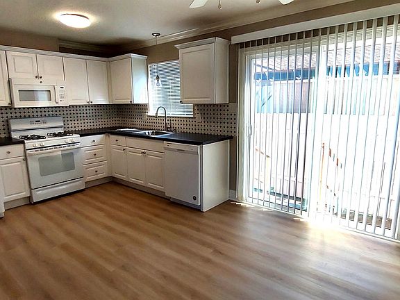 Kitchen with Gas Range, Microwave and Refrigerator