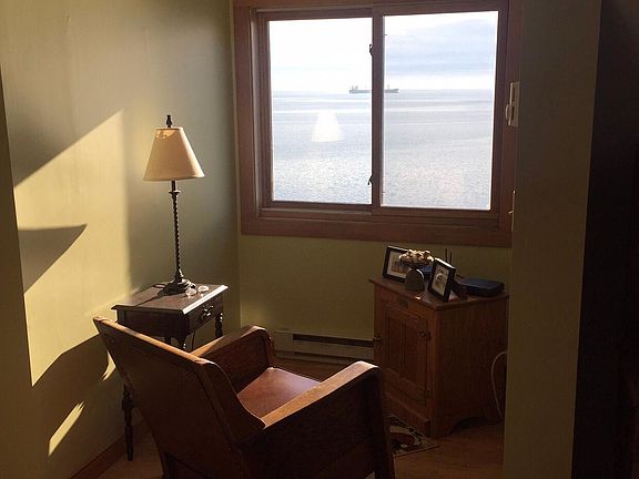Bedroom with view of lake