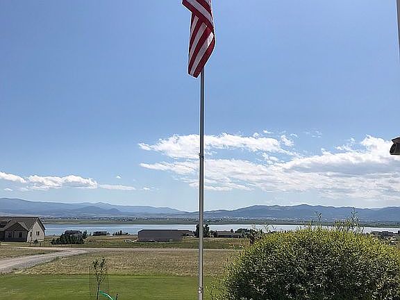 Flag by house with lake view