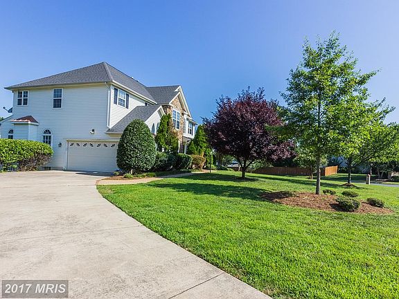 2 car garage with a long driveway entrance
