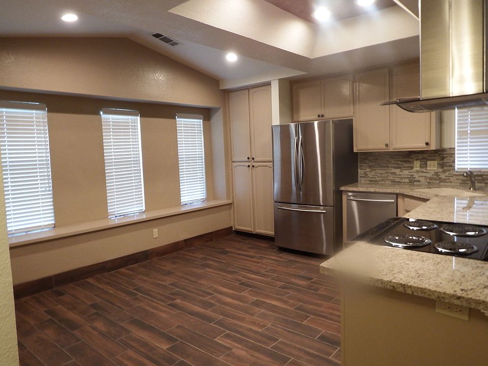 Spacious kitchen/dining room with recessed lighting, extra pantry and window seat.