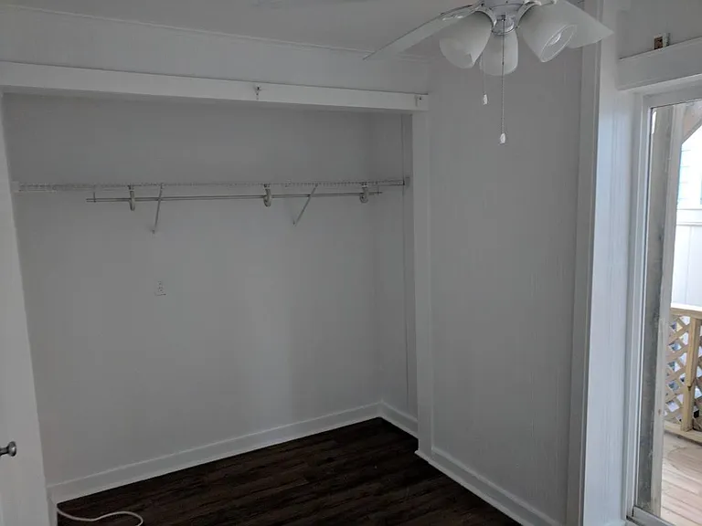Bedroom closet, back deck, privacy fence.