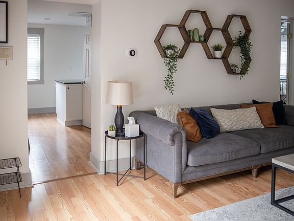 Living area with neutral paint and laminate flooring.