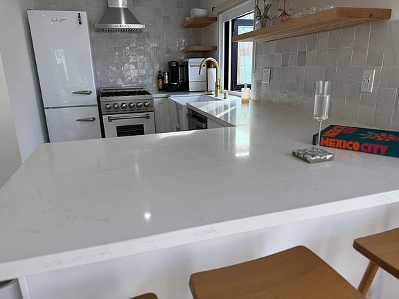 Kitchen includes a z-line gas top stove, dish washer, Nespresso coffee maker and gevi ice maker.