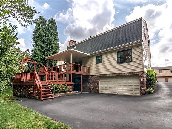 Two tiered deck with cover patio and rear entry garage.