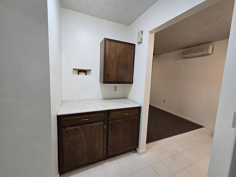 Multi purpose counter with storage. Located in hallway