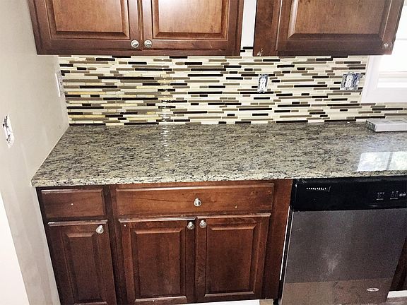 Granite Countertops and Tiled Backsplash