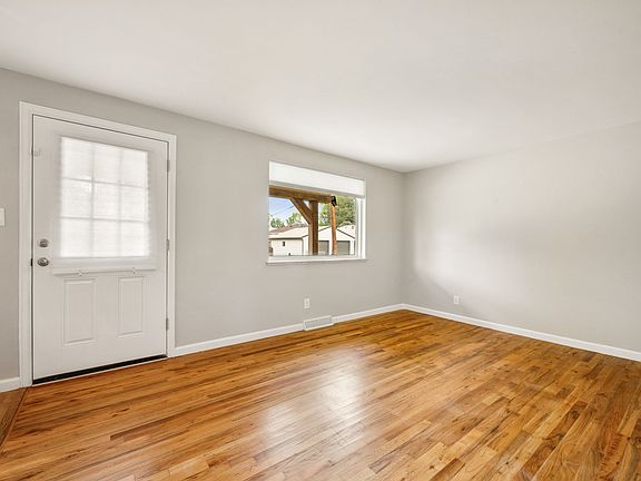 Neutral tones and real wood flooring offer a versatile backdrop ready for your personal style.