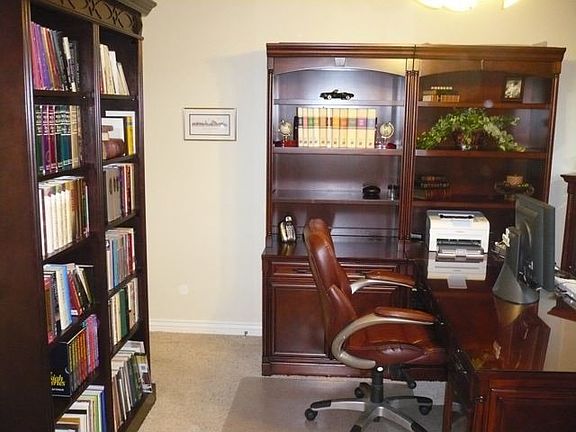 French doors lead to the spacious office/den