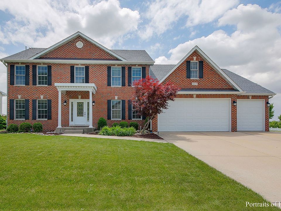 Gorgeous brick front home with a surprise 4th car tandem garage with overhead door leading to the ba