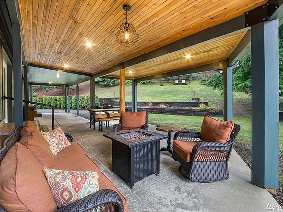 Deep covered patio that runs the entire length of home in back.