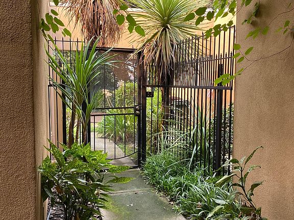 Gate adds privacy to front entry area.