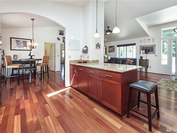 Kitchen connects to dining room with arched doorway