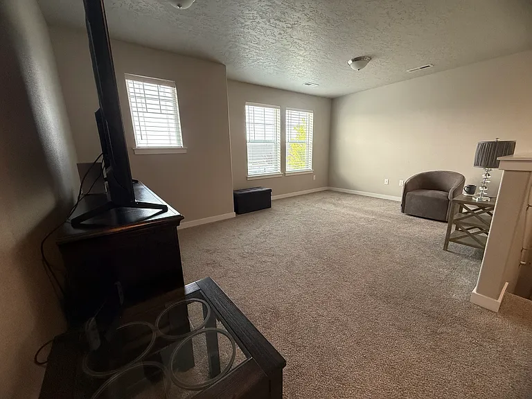 Open up stairs super loft with multiple windows and flexible living space. Room size about 12'1"x 17'8".