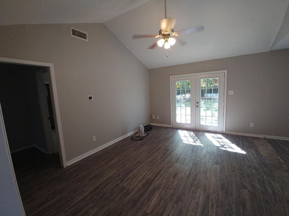 This is the Family Room, French Doors, Nest Thermostat, High ceilings. Many of the pictures you see still have construction materials visible, and things are still dirty. House will be clean soon!!