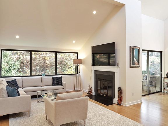 Living room with wood burning fireplace