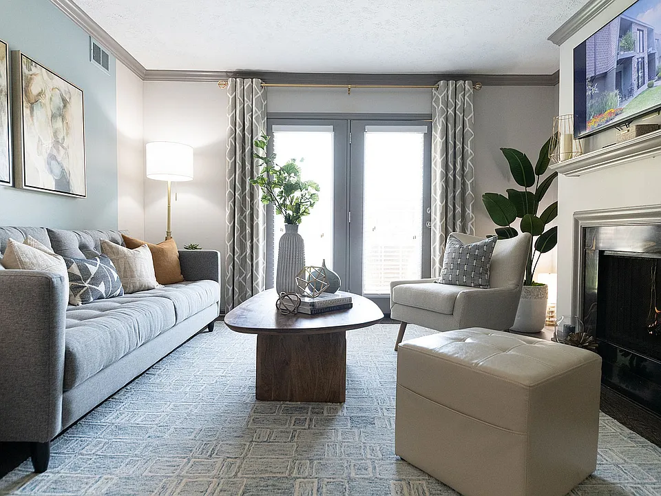 Spacious living room with hardwood-style flooring & fireplace
