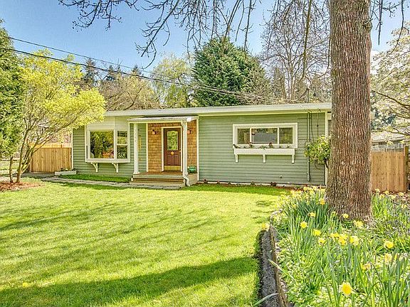 Privacy and exceptional natural light in this fantastic 2+ bedroom home. Perfect blend of indoor/outdoor living with multiple sets of french doors leading to impressive, large back deck. Many updates include new electrical, new sewer line & newly refinished hardwood floors. Possibilities are endless with this 8,100 sq foot lot. Possible MIL, artist studio or home office with additional 3/4 bathroom & partial kitchen off garage-not reflected in listing bedroom/bathroom count or square footage.