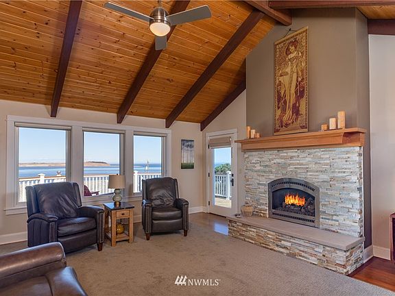 Propane Fire Place for chilly days and nights or for the ambience as you enjoy the view. Personally THOSE CHAIRS should swivel (her last ones did), to watch the ever changing views. Door to left of FP leads to the outside (NEW!!) deck.