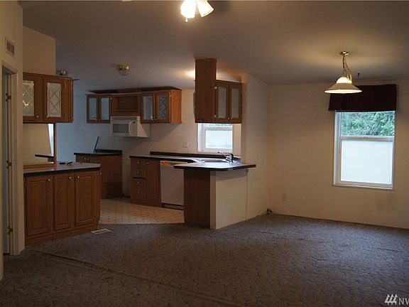 Photo taken from large living room looking toward dining room and kitchen.