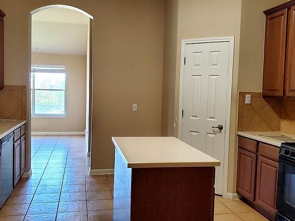 The kitchen is truly the center of the house. The living space wraps around the kitchen area.