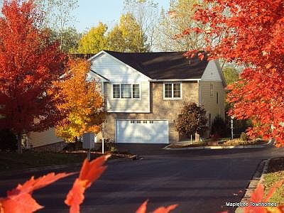 Archieved view of 2815 in the fall. Today, the crimson maple tree is full grown, and the entry to the Mapletree Townhomes is still ablaze with colors in the fall.