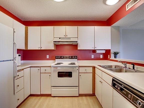 Find gorgeous Maple hardwood floors in this open Kitchen.