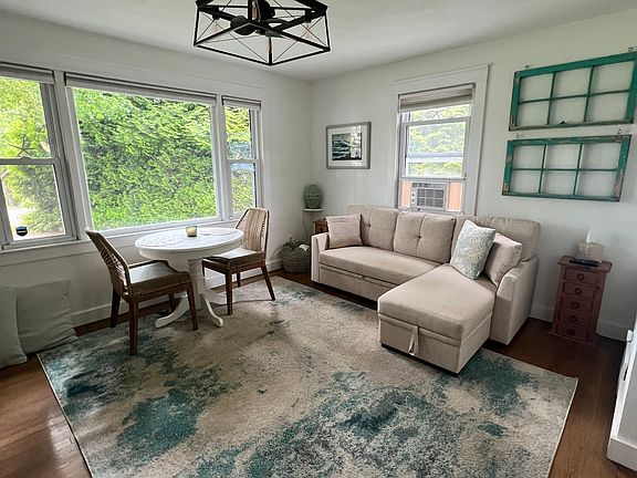 Open-concept living room flows into a bright, airy kitchen for easy gathering and entertaining.