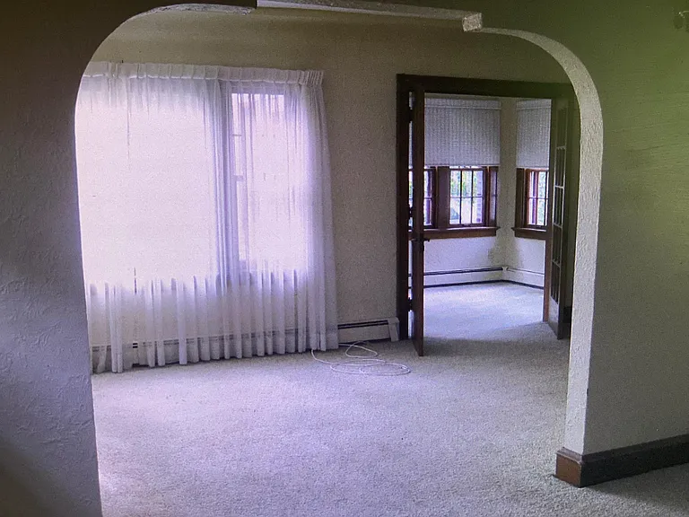 Dinning room through living room to sunroom