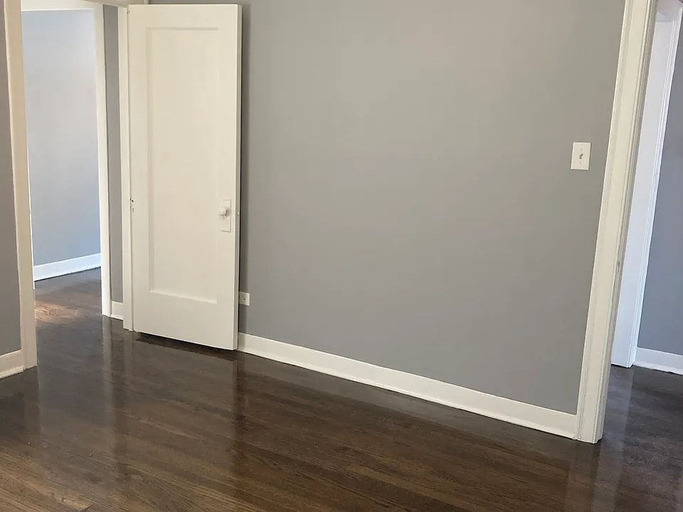 Primary bedroom/ Master Bedroom with 2 doors to enter and exit one door lead near front entrance door and living room other door leads to hallway that leads to dining room or near bathroom
