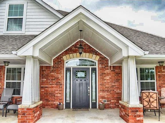 Dramatic cathedral entry with Craftsman-style columns.