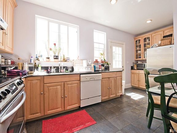Top Unit - Updated eat-in kitchen adjacent to Side Patio