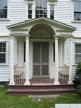 Front door with the original louvered summer shutters