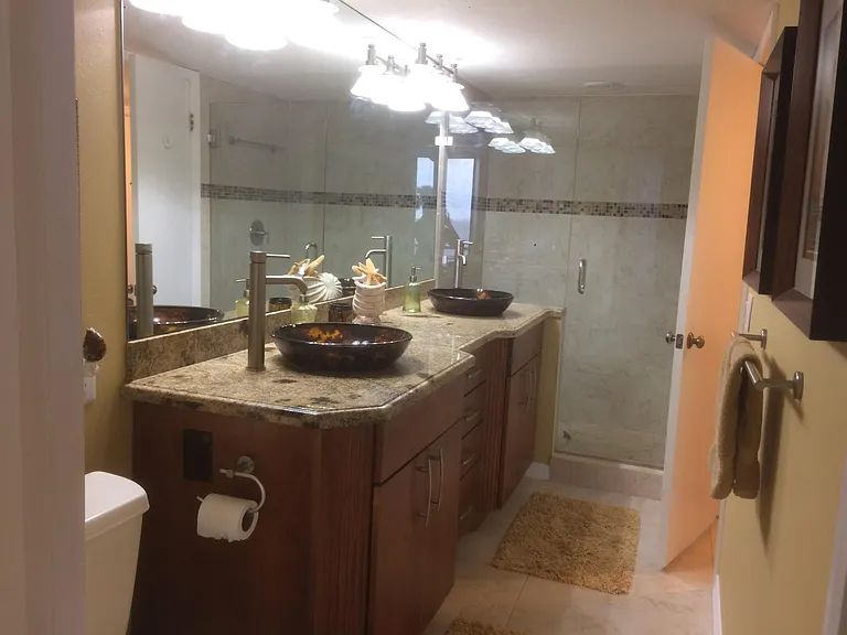 En Suite Bath #2 Dual Vessel Sinks With A Large walk in shower.