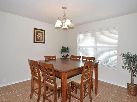 As you enter the front door, the spacious dining room is located to the right. The bank of windows a
