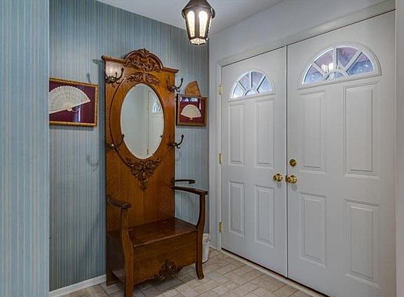 The entry hall with closet to greet guests