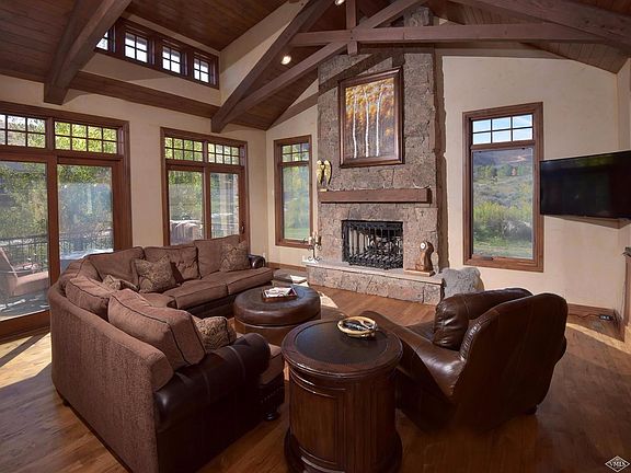 large living room with vaulted ceilings & gas fireplace