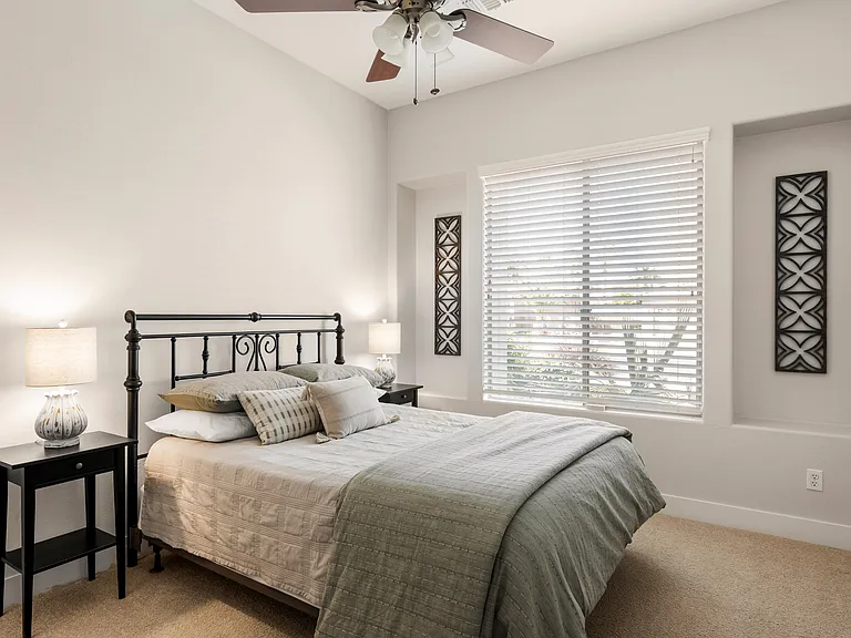 Bright and welcoming third bedroom with queen bed