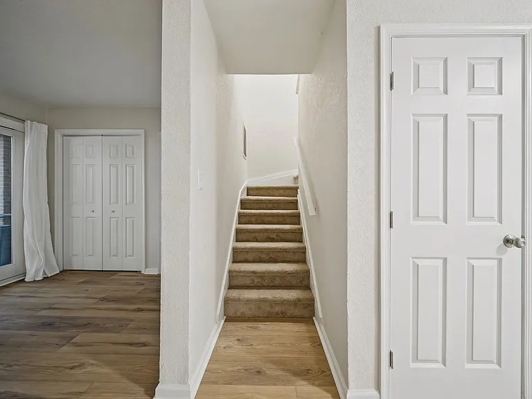 Bottom of stairs leading to second story