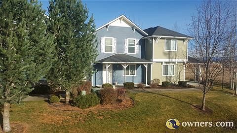 Blue house, covered front porch, faces Poleline